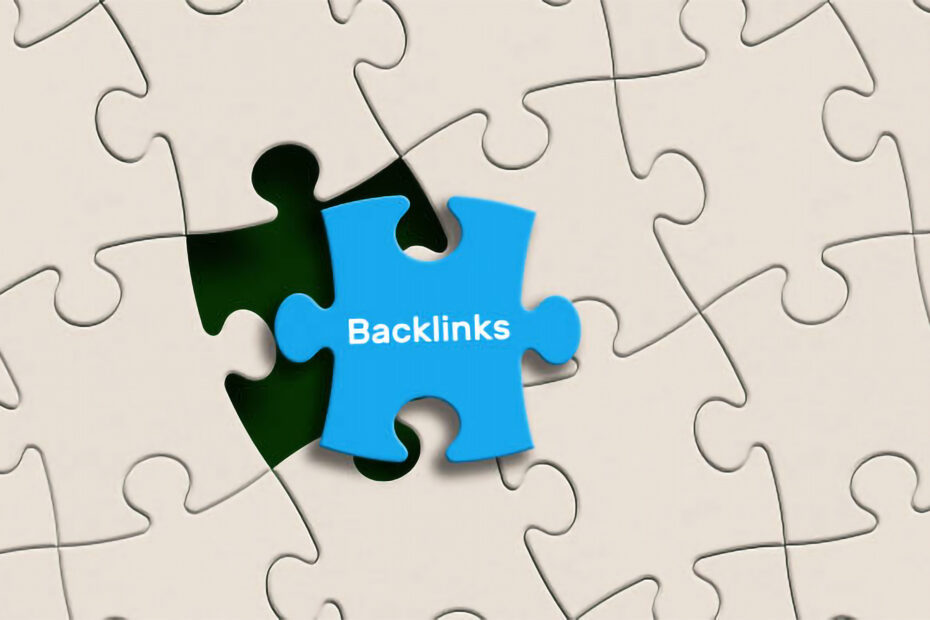 um quebra-cabeças branco com uma peça azul escrito backlinks